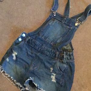 Fashionable ripped jean overalls